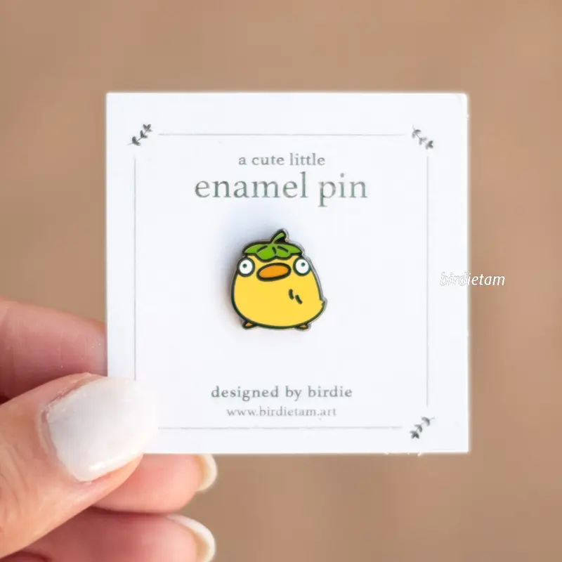 Enamel pin - Mini duck with a leaf